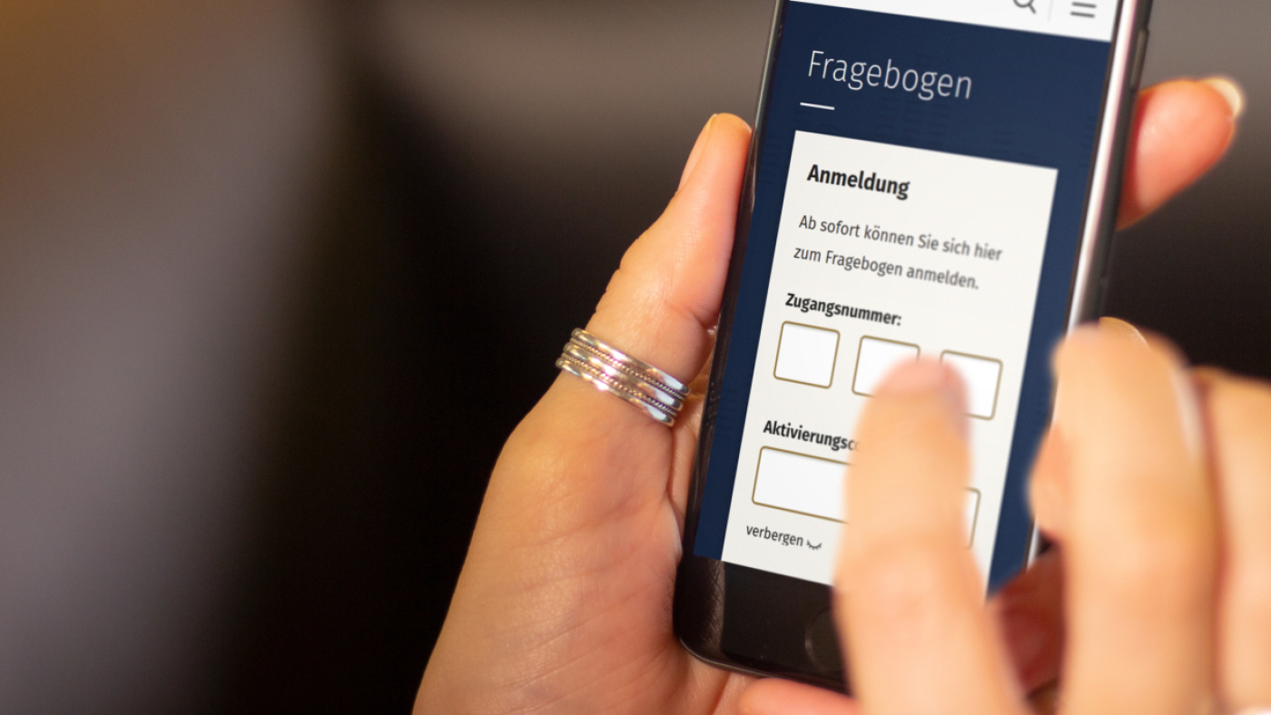 Hand using a smartphone showing an app